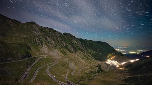 Star trails in the night sky over Transfagarasan mountain road