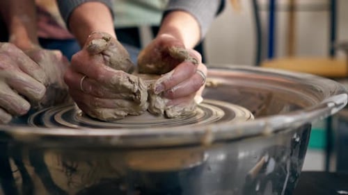 Close Up the Clay Modeling Studio Young Girl Hands Giving Shape to Clay on a Potter's Wheel Applied