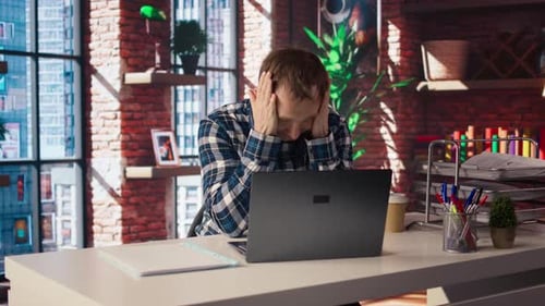 Man at Computer Dealing With Tech Problems