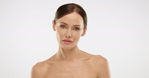 Beautiful Woman Posing in a White Studio