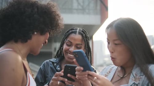 Slow Motion of a Trans Woman Chatting and Using the Mobile with Friends in the City