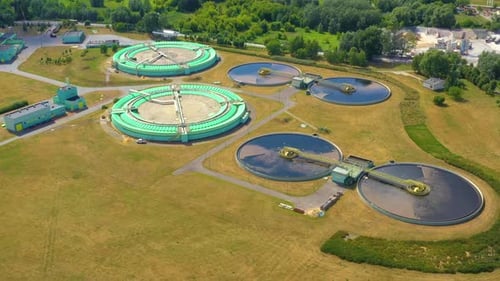 Aerial view of modern water cleaning facility at urban wastewater treatment plant. Purification proc