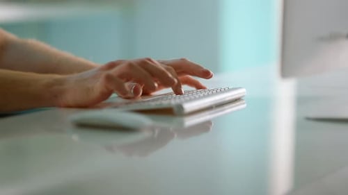 Closeup Hands Typing Keyboard At Modern Office. Manager Using Wireless Device. Unrecognized Man D...