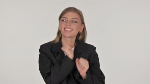Young Woman Dancing in Front of White Background