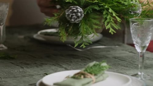 Festive Christmas Table with Evergreen Centerpiece