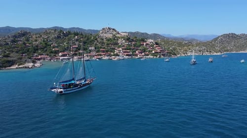Beautiful view of the beach with boats, pure nature, sea and ships. Shot from a drone.