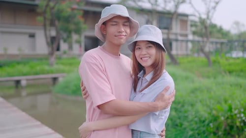 Affectionate Young Couple Embracing in a Lush Park