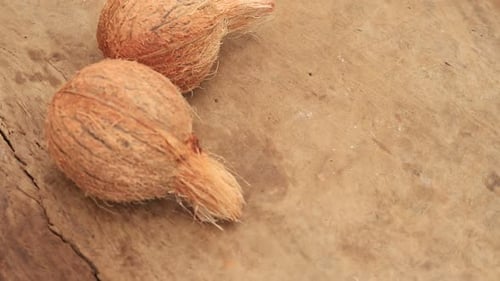 Coconuts on Wooden Surface