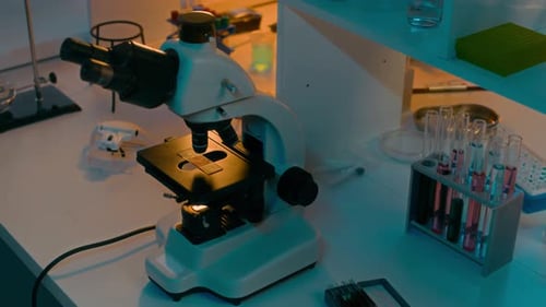 Microscope on Lab Bench with Test Tubes