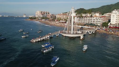 Aerial Drone Zoom Out Pier Boats, Puerto Vallarta Mexican Beach Town, Blue Ocean in Pacific Coastlin