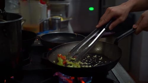 Chef Cooking Vegetables in a Commercial Kitchen