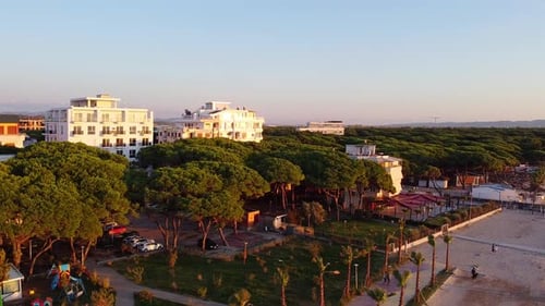 Aerial view of scenic albanian landscape with hotel buildings in front of the beach.