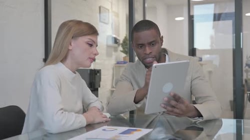 Business People Working on Tablet in Office