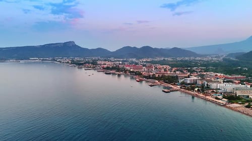 Scenic coastal view of a seaside resort. Scenic view of a coastal resort at sunset