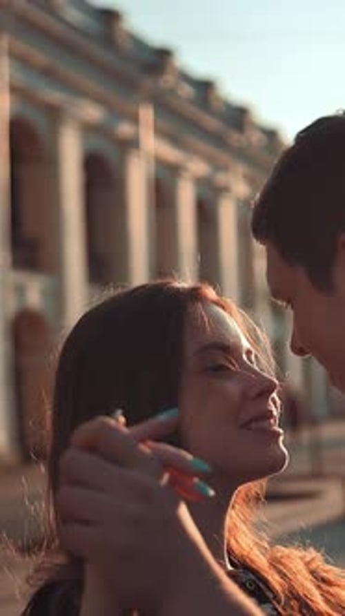 Vertical of Attractive Man and Young Woman Having Fun in the City