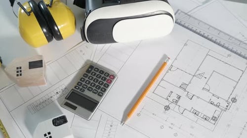 Blueprint Design with VR Headset and Miniature Houses
