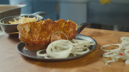 Tasty Kebab With Onions On Plate