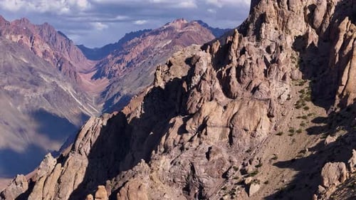 Dramatic Mountain Range Scenery Featuring Rugged Terrain and Captivating Shadows