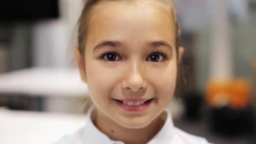 Close up of smiling girl with fair hair
