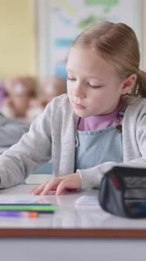Girl, writing and test in classroom for education, thinking or problem solving for maths quiz