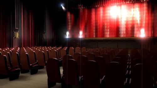 Empty Theater with Red Velvet Seats and Bright Stage