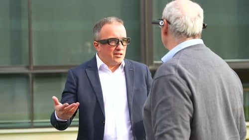 Men Discuss Technology Wearing Smart Glasses Outdoors