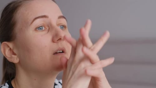 Thoughtful Woman Gazing Intently Indoors