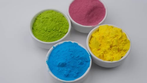 Vibrant Colored Powders in White Bowls