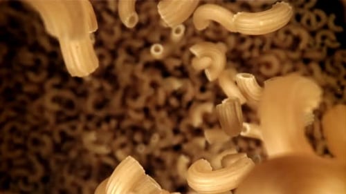 Elbow Macaroni Pasta Falling in Slow Motion