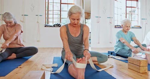 Fitness, yoga and senior women with band for wellness, healthy body and stretching on floor