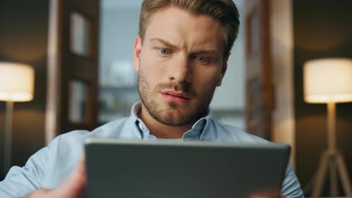 Focused Man Reading Pad Computer Zoom Out Serious Businessman Zooming Screen