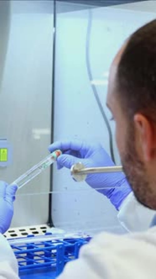 Scientist Working with Test Tube in Laboratory