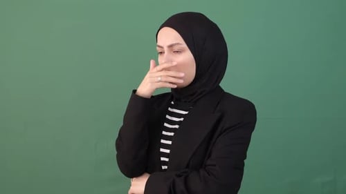 Woman Coughing in Front of Green Screen