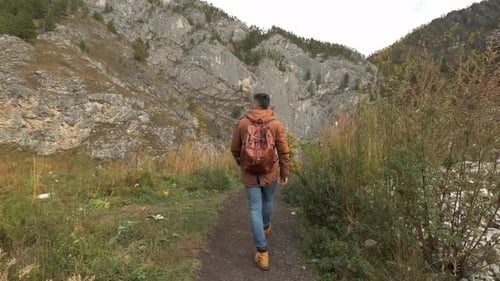 Hiker Tourist Traveler Man with Backpack at Mountains Outdoors River Hiking Travel Landscape Nature