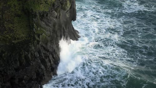 Icelandic Black Coast at Sunset Volcanic Cliffside with Blue North Atlantic Ocean Water Shot in 8K
