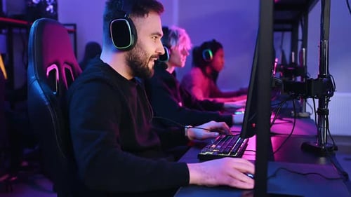 Competition conception. Gamers are playing video game by computers.