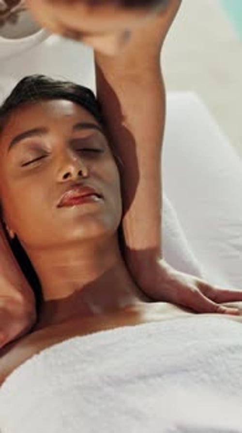 Women, shoulder massage and relax at spa, smile and holistic treatment for muscle