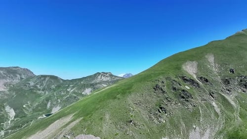 Rotating drone shot of a mountain peak in the Mercantour national park