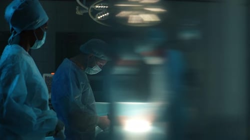 Professional Cooperating Team of Multiethnic Surgeons Performing Organ Transplant Operation Surgery