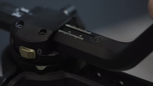 Close Up of Adjusting Camera Tripod Settings