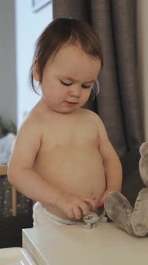 Cute Baby Playing with Toys at Home