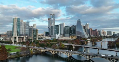Truck shot of downtown Austin skyline over the Colorado River infront of the Lamar Blvd Bridge