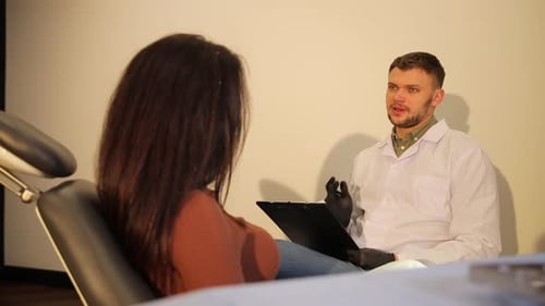 Doctor Consults with Patient in Medical Office
