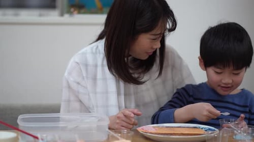 Woman and Boy Doing Arts and Crafts Together