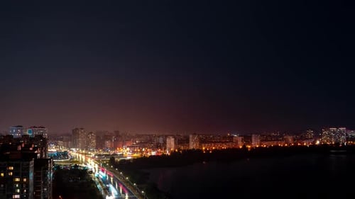Timelapse of the Night City Roads with Moving Cars Near the River