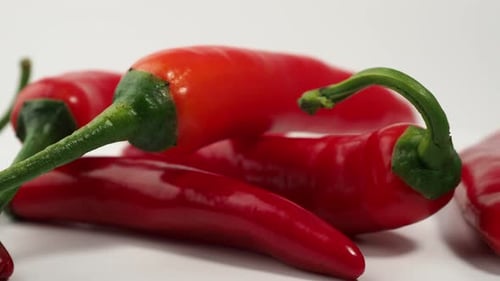 Red Chili Peppers Close Up on White Background