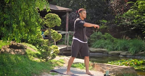 Healthy African American Man Exercising Ar Park Outdoor Practicing Yoga