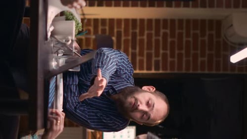 Man Leading Meeting in Brightly Lit Corporate Office