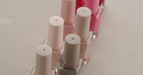 Cosmetic Nail Polish Bottles in a Row, Dolly Shot
