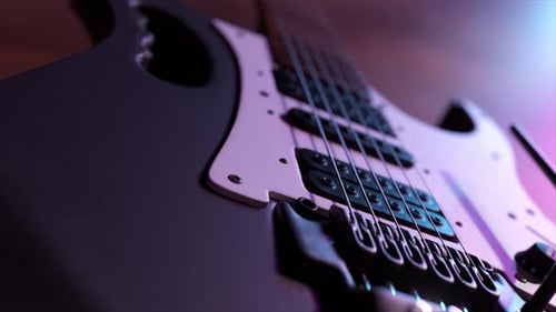 Closeup View of a Modern Electric Guitar Body with Its Pickups and Strings Beautifully Illuminated